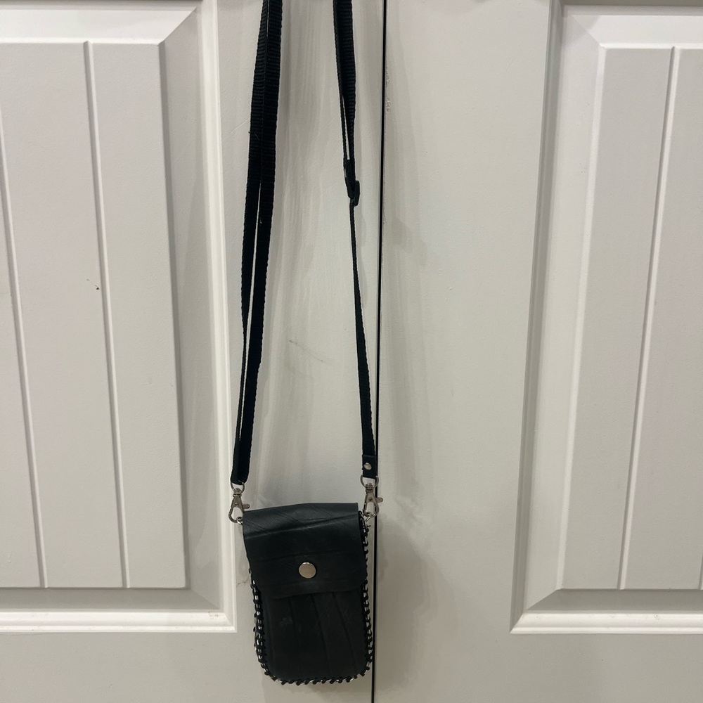 Pocket purse made of used tire and can tops!